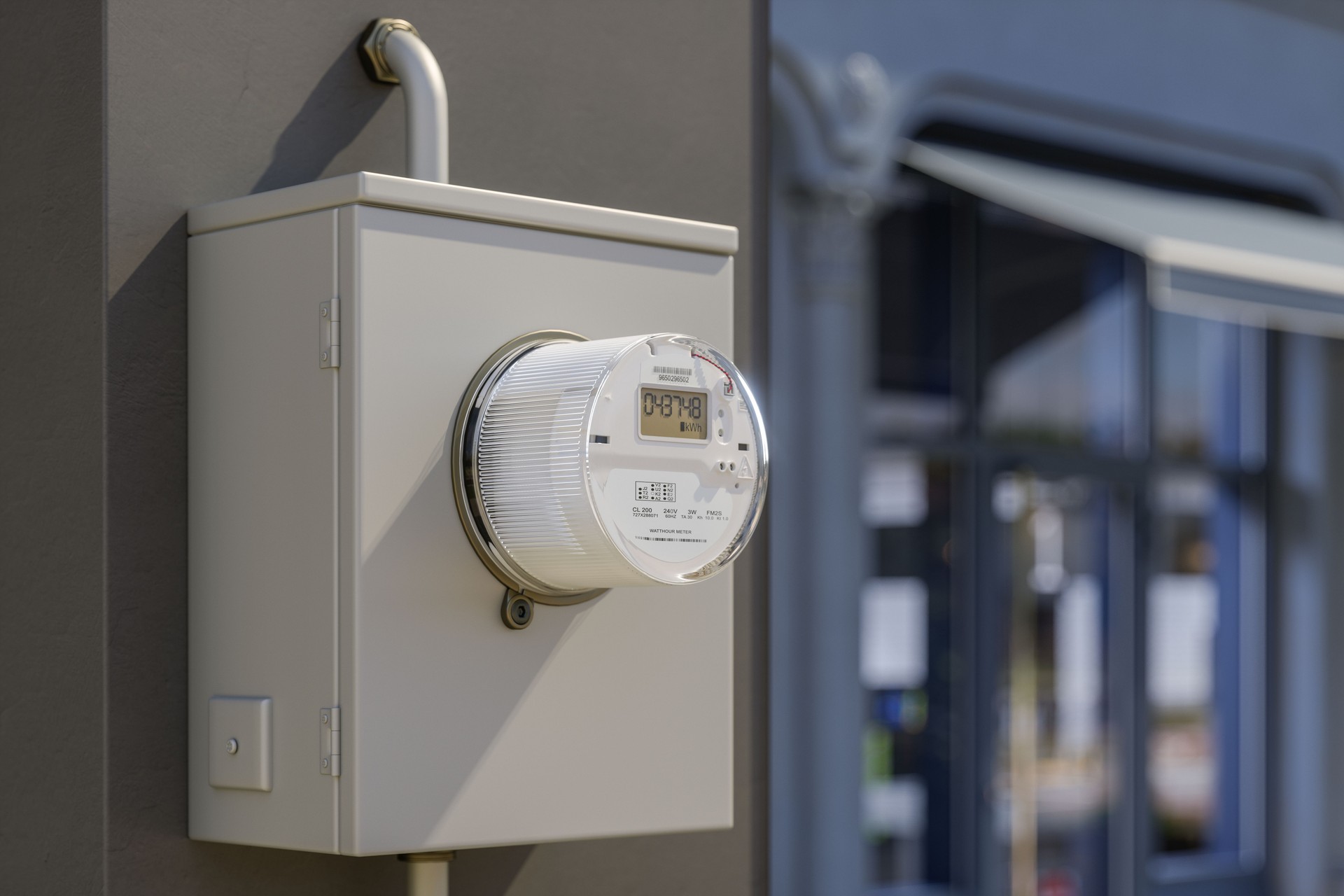 Close-up View Of Electric Meter On Building Facade With Blurred Store Window Background